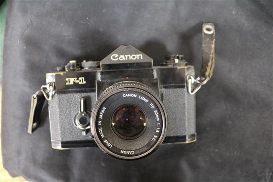 A Canon F-1 camera with Canon 20mm lens DD-100-200mm 1:5.6 SC